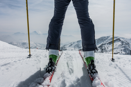Wide angle shot of skier and mountainsの写真素材