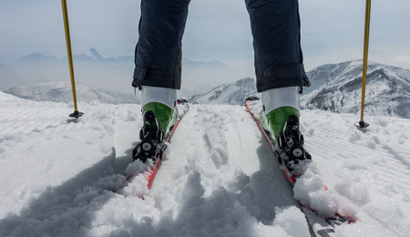 Wide angle shot of skier and mountainsの写真素材