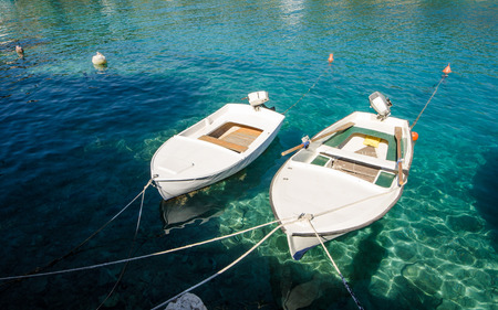 Boats in clear blue sea in summer timeの写真素材