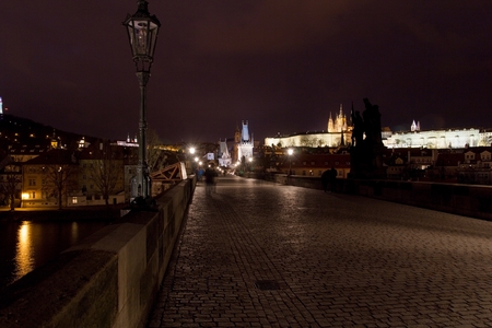 Evening panorama of the Old Town architecture with Vltava river and Prague Castle with St.Vitus Cathedral in Prague, Czech Republicのeditorial素材