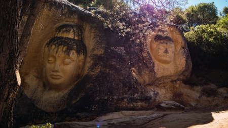 Faces carved in stone on the Route of Facesの写真素材