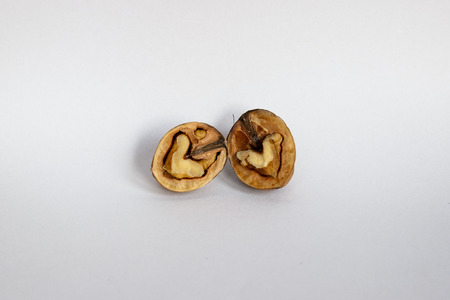 Splitted Walnuts Shape Hearts Isolated on Whiteの写真素材