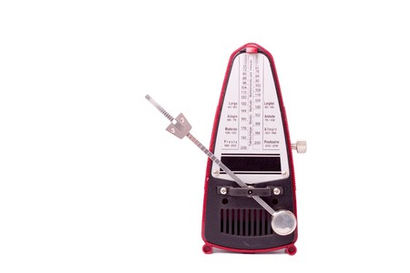 A metronome against a white background. The swinging arm is angled away to reveal the sliding scale...