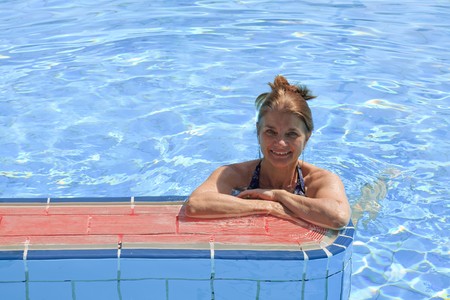 A woman enjoying the swimming pool