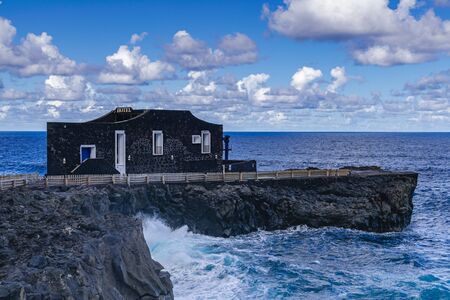 La Frontera, El Hierro / Spain; April 3 2019: Punta grande hotel, on volcanic rocks coastline, with Atlantic ocean background, El Hierro, Canary islands, Spainのeditorial素材