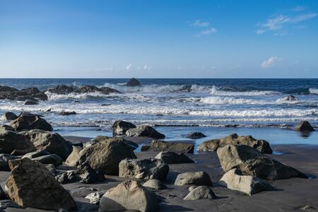 Benijo beach rocks with sunset light and blue sky, Anaga natural park, Tenerife, Canary islands,...