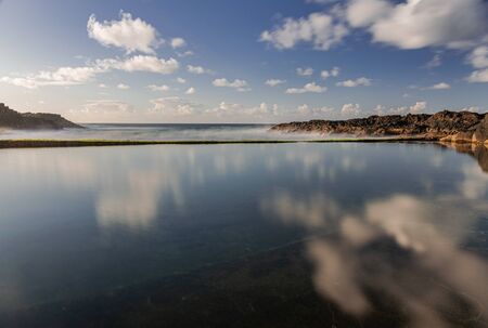 El Pris ocean pool and wall with green moss, close to Atlantic ocean with volcanic rocks, long exposure photography, Tacoronte, Tenerife, Canary islands, Spainの写真素材