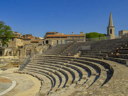 Arles / France; May 6 2013: Arles Roman theater, UNESCO World Heritage Site, with sunlight and blue...