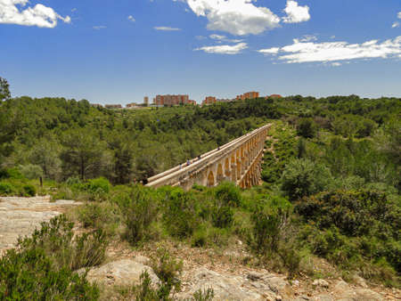 The Ferreres Aqueduct landscape, also known as the Pont del Diable, Tarragona, Catalonia, Spainの写真素材