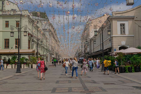 Moscow / Russia; June 22 2019: People walking around Kamergerskiy Lane, in a summer day