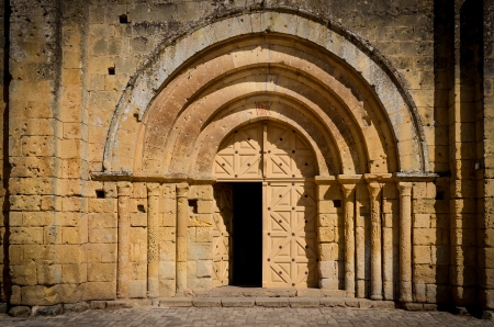 Stone church entrance door and arcs, St Emilion, Franceの写真素材