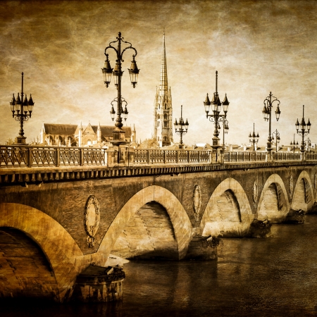 Bordeaux river bridge with St Michel cathedral vintageの写真素材