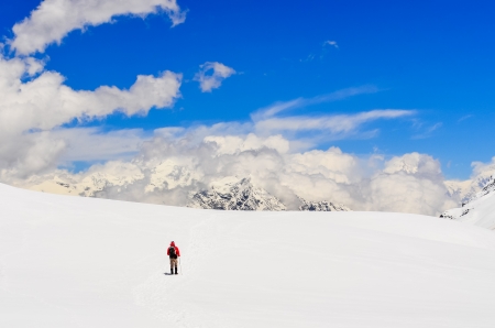 Mountain trekker walking in high winter Himalayas mountains, Nepalの写真素材
