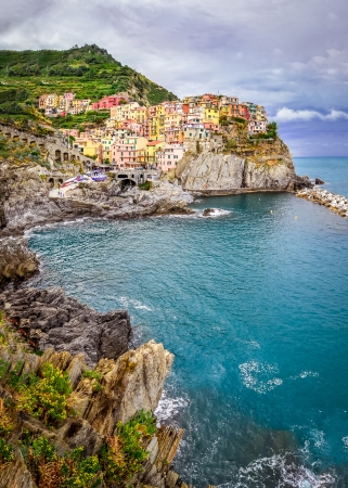 Scenic view of colorful village Manarola and ocean coast in Cinque Terre, Italyの写真素材