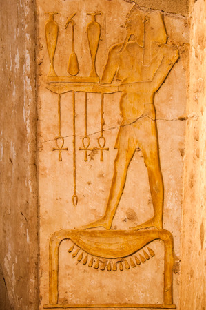 Detail of ancient hieroglyphs carved in stone Queen Hatshepsut temple Egyptの写真素材