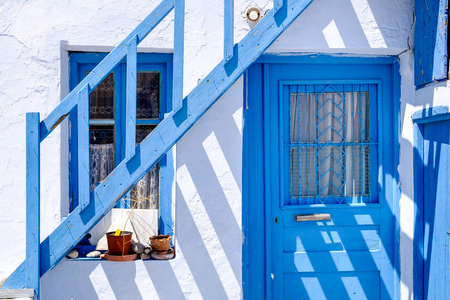 Detail of typical traditional doors and windows in white and blue style, Plaka village on Milos island, Greeceの写真素材