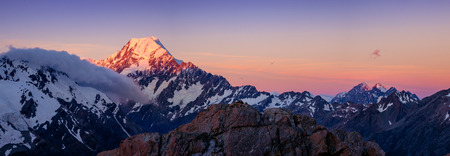 Panoramic view of Mt Cook mountain range at colorful sunset, South island of New Zealandの写真素材