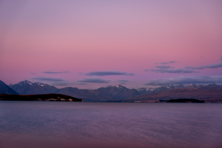 Colorful dreamy landscape of Lake Tekapo at sunset, South Island of New Zealandの写真素材