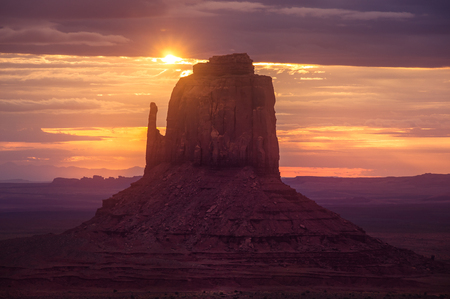 Beautiful sunrise landscape at Monument valley national park, with sun flare, Arizona, USAの写真素材