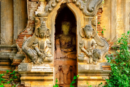 Detail of old stone temple ruins with statues, Myanmar (Burma)の写真素材