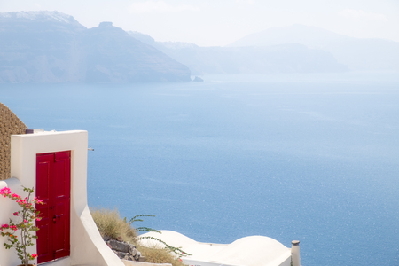 Detail of red terrace door with ocean background, Santorini, Greeceの写真素材