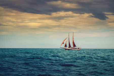 Traditional sailing ship in the ocean, dramatic moody styleの写真素材