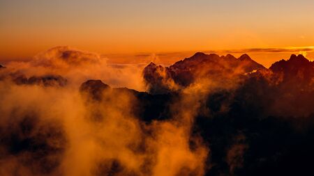 Panoramic landscape view of colorful clouds and mountains at sunrise, High Tatras, Slovakia, Europeの写真素材