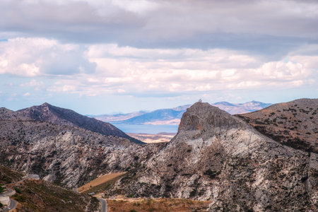 Scenic view of mountains and distant church in Naxos island, Greeceの写真素材