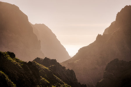 Sunset landscape view of ocean coastline hills, near Masca, Tenerifeの写真素材