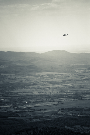 A helicopter crossing Bihor Mountainsの写真素材