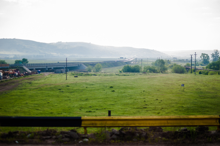 Field landscape with highway in focusの写真素材