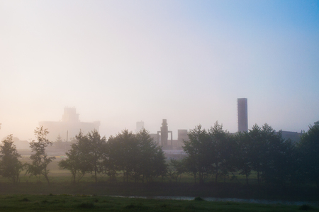 Industri, tree and fog betweenの写真素材