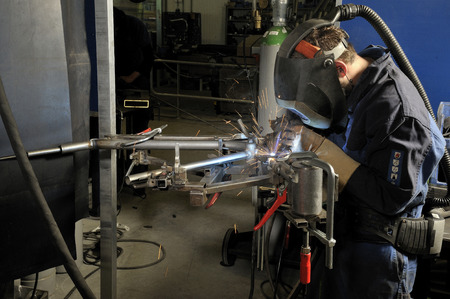 welder with protective cap at work