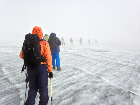 A group of hikers ascending Margherita Glacier in the Rwenzori Mountains, Uganda