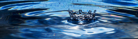 Crown consists of a drop of water on black backgroundの写真素材