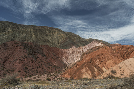 Strange cloud formations on colorful desert mountainsの写真素材