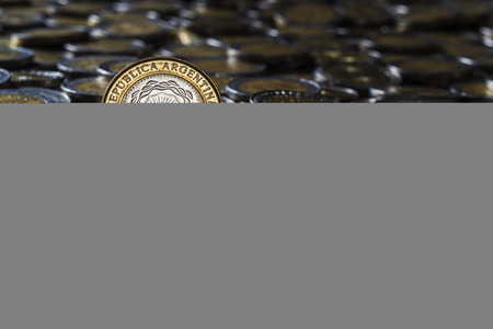 two peso coin on a group of focus coinsの写真素材