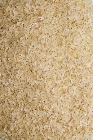 white rice grouped together to form a backgroundの写真素材