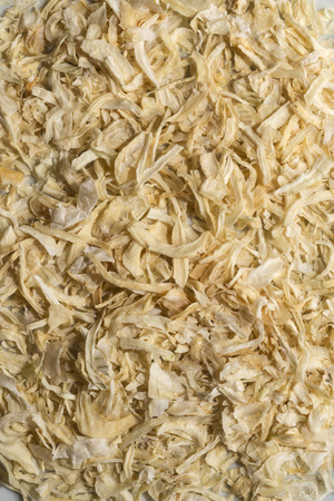 dried onion grouped together to form a backgroundの写真素材