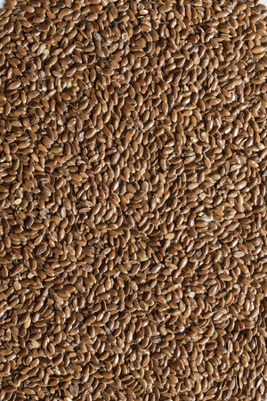 flax seeds grouped together to form a backgroundの写真素材