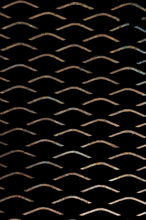 Metal background texture or deployed on black background lit from belowの写真素材