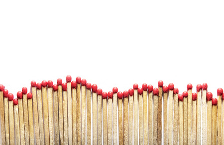 many matches at the bottom of a photo on white backgroundの写真素材