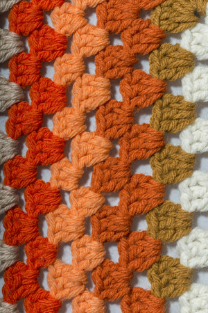a handmade crochet fabric of different colors