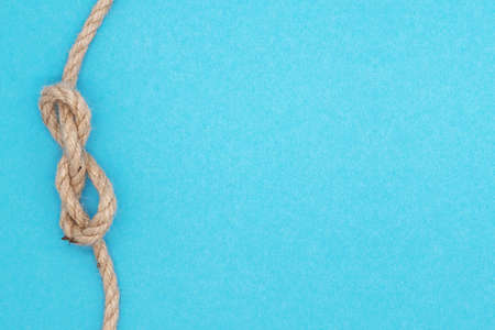Summer nautical composition, bright background with rope nodal knotの写真素材