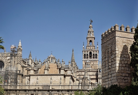 Giralda, famous bell tower of the Seville Cathedral in Spanish city of Sevilla, built as a minaret and rebuilt as a tower of famous church as a symbol of Arab and Moorish architectural period in Spainのeditorial素材