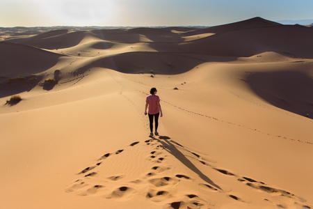 Erg Chebbi, Sahara Desert in Morroco : October 24 2017 : woman  in the desert  of Sahara in Morocco.のeditorial素材