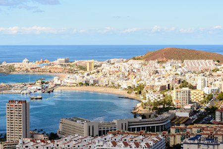 Aerial view over Los Cristianos beach and Adeje coastline in summer holiday, in Tenerife, Spainのeditorial素材