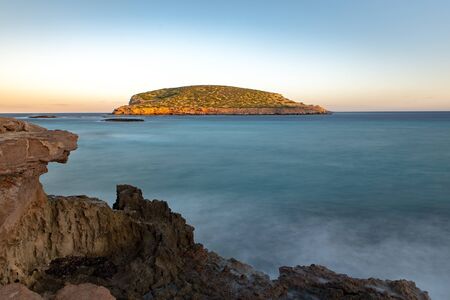 Ibiza sunshine from Cala Conta Comte in San Jose at Balearic Islands Spain.の写真素材