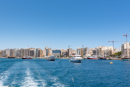 Beautiful Valletta skyline under blue sky, Valletta to Sliema Ferry, viewed from Manoel Island across Marsamxett Harbour. Valletta, Capital city of Malta, November 2019のeditorial素材