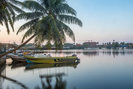 Sunshine over Bentota river, Galle district, Sri Lanka on a perfectly still day under a cloudless sky. Bentota, Sri Lanka.の写真素材